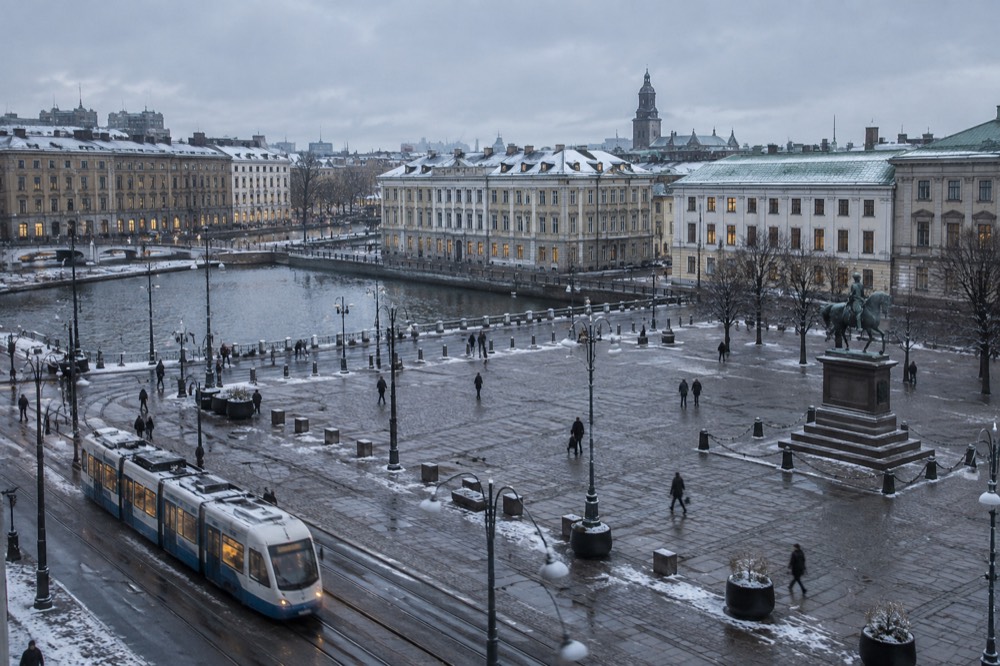 Frost-covered rooftops of Gothenburg seen under a pale grey winter sky near the canal