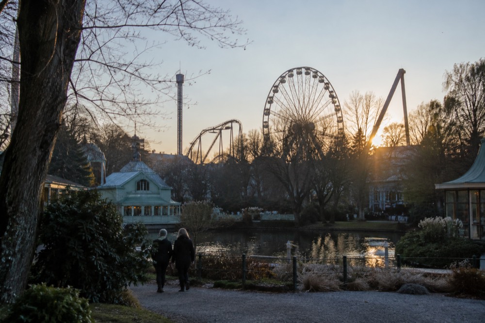 Ferris wheel and amusement park rides against an evening sky above Gothenburg