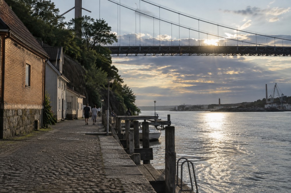 Evening light on the Göta älv with the bridge silhouetted against a summer sky
