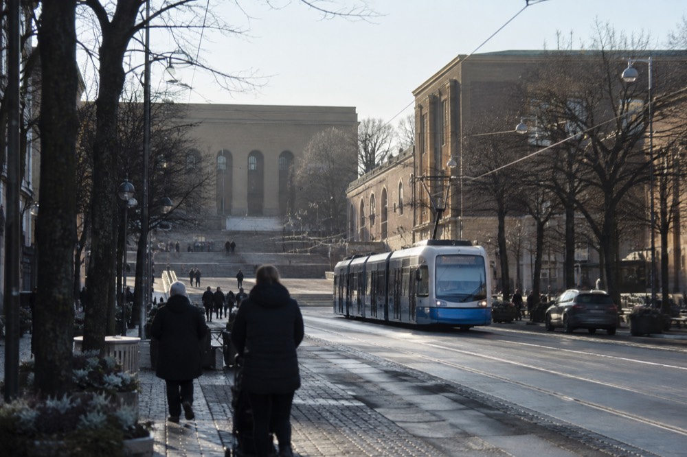 A Gothenburg tram passing along the tree-lined Avenyn avenue toward Götaplatsen