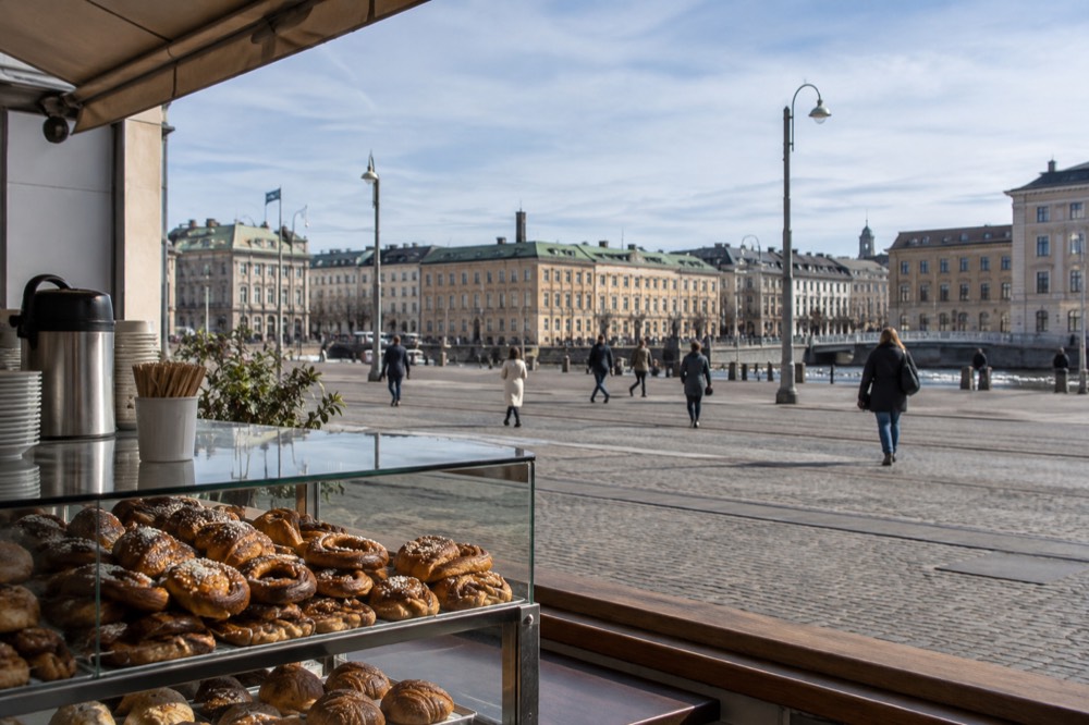 A small neighbourhood bakery counter with cardamom buns and coffee in Gothenburg
