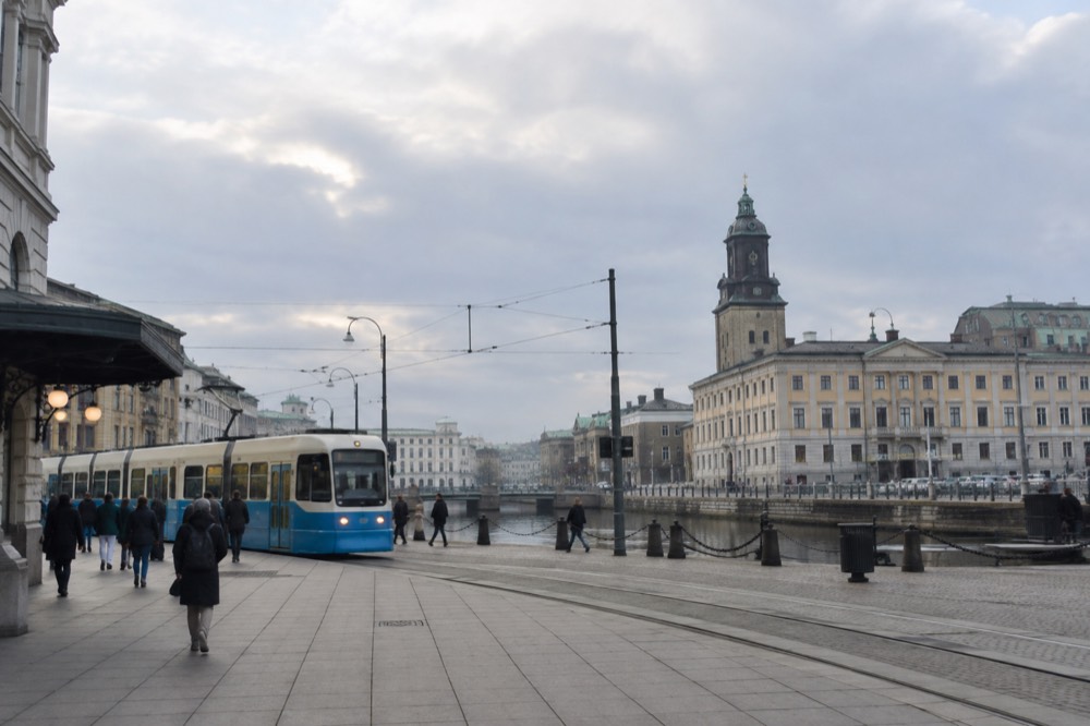 Tram and pedestrians outside Gothenburg Centralstation on a grey day