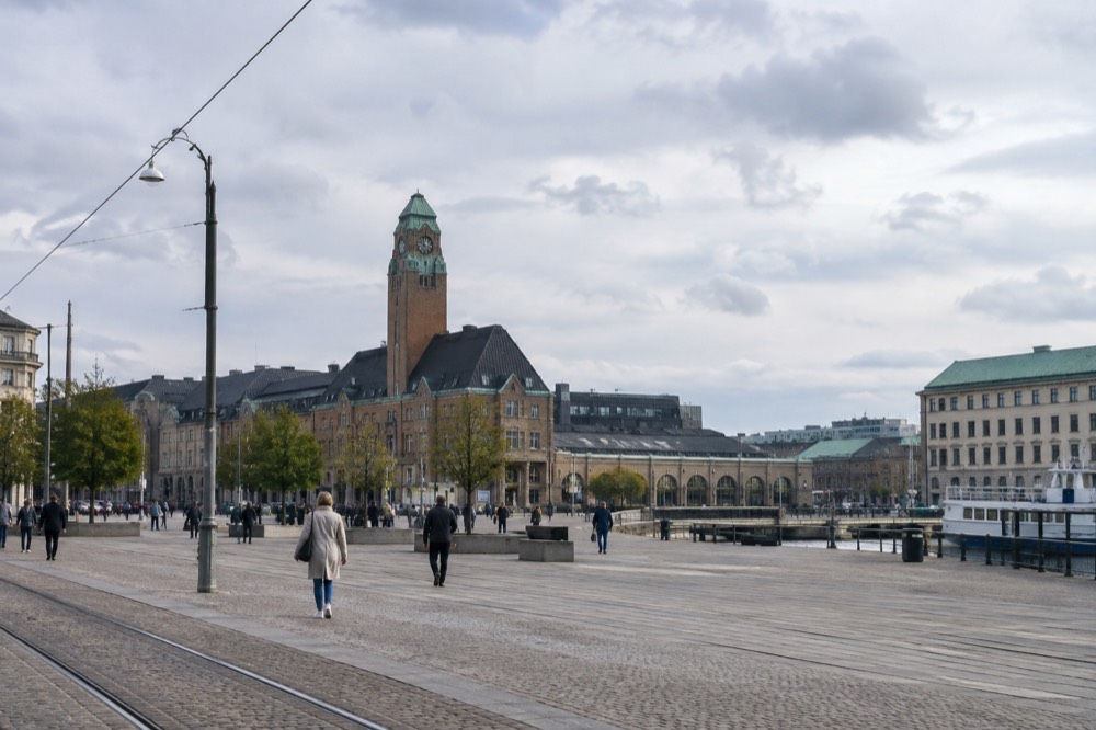 The brick clock tower of Gothenburg Central Station against a grey Nordic sky