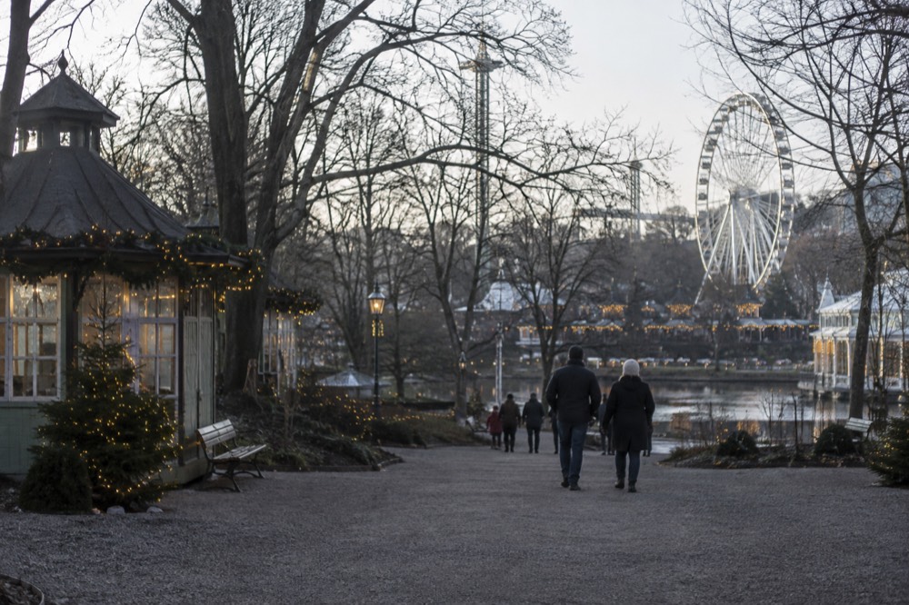Ferris wheel and Christmas lights at Liseberg amusement park in the evening
