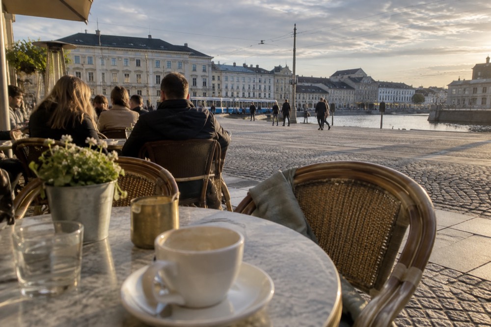 People sitting outside a Gothenburg cafe in spring sunshine