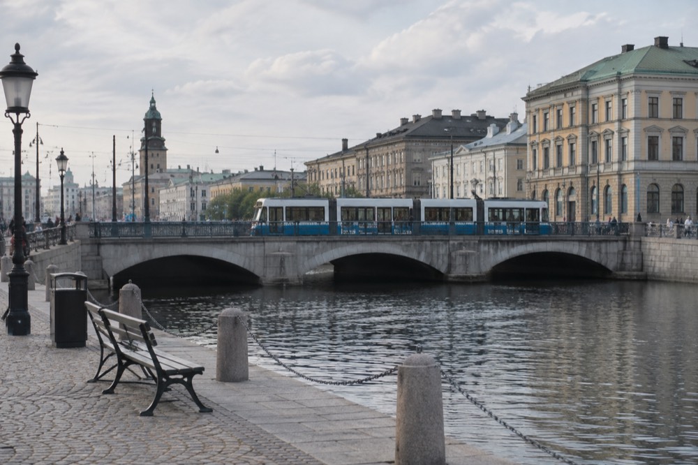 A Gothenburg tram crossing a stone bridge over the city canal
