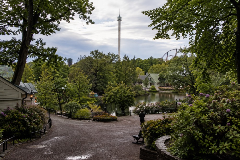 A tall drop-tower ride against open sky
