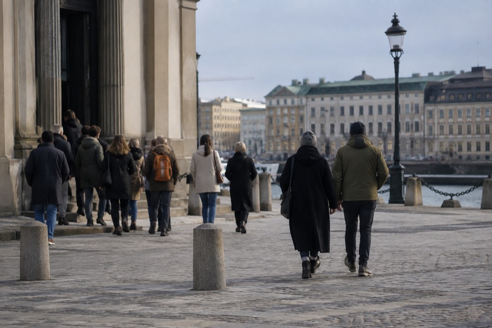 Visitors outside a museum entrance on a stone plaza in Gothenburg