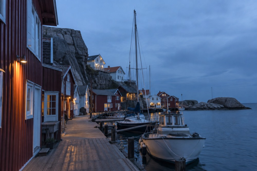 Granite harbour with wooden boathouses on the Bohuslän coast of Sweden