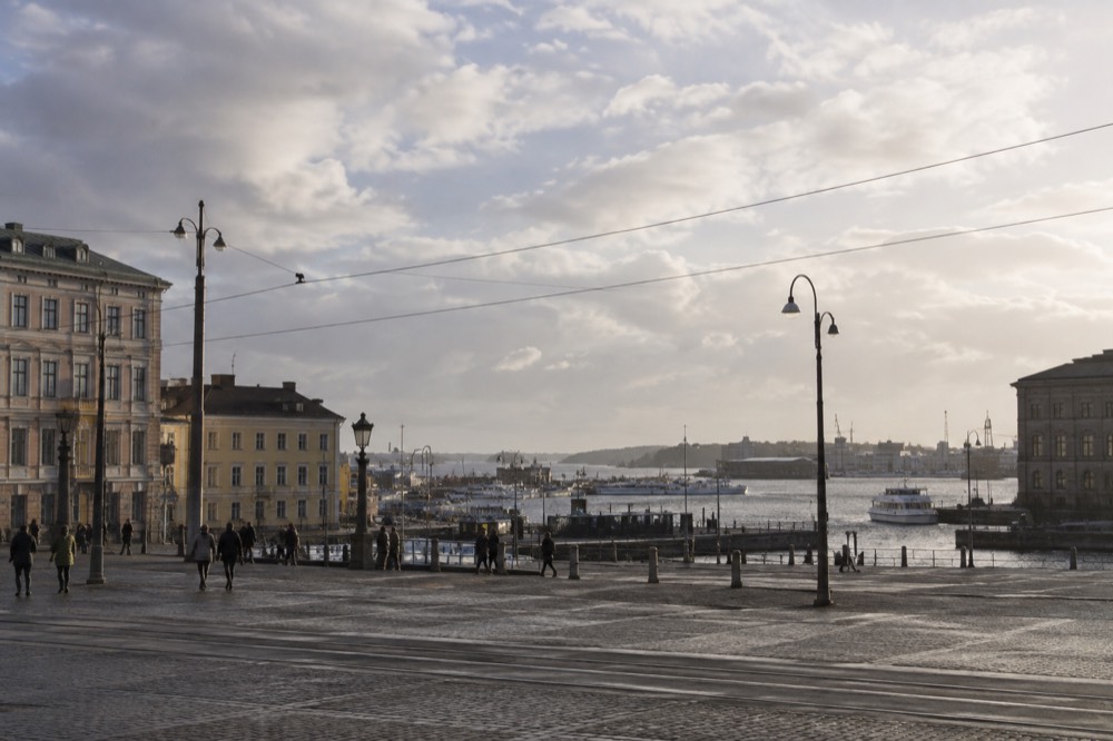 View over Gothenburg rooftops and harbour toward the archipelago as clouds break after rain