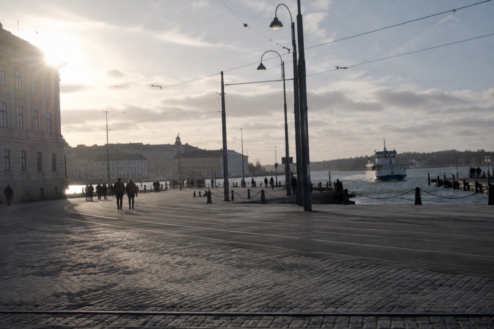 White ferry approaching wooden jetty at car-free archipelago island