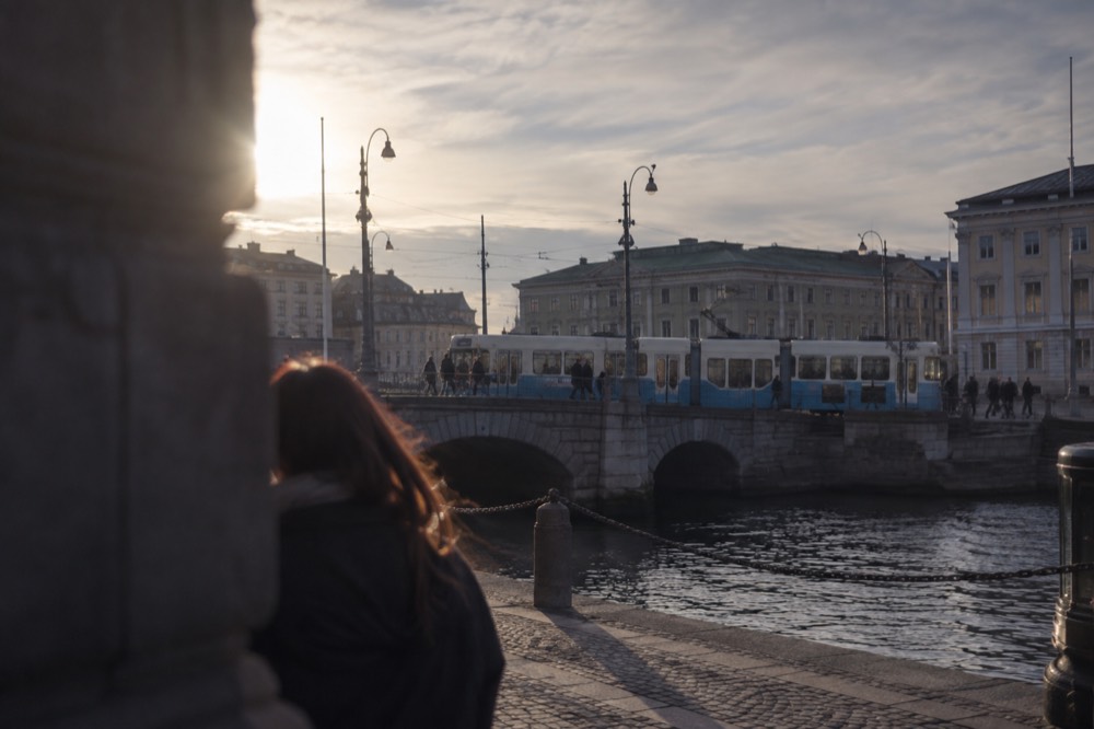 A Gothenburg tram crossing a stone bridge in the city centre